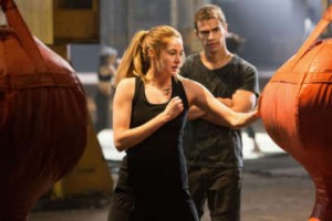 Tough love: Actors Shailene Woodley (centre) and Theo James (right) star as Tris and Four, love interests in "Divergent". Photo courtesy of Lionsgate.