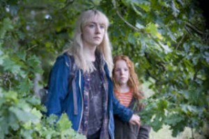 Girls stick together: Saoirse Ronan (Daisy) and Harley Bird (Piper) must stik together to survive Wolrd War Three in "How I Live Now". [Photo courtesy: Magnolia Pictures]