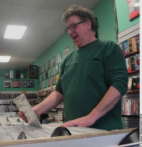Owner John Thompson arranges records in his Wellington Street store, The Record Center
