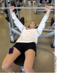 Carleton student, Cynthia Winker, 21, listening to Songza while she lifts weights.