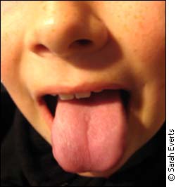 kid pokes tongue out