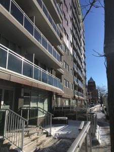 The ground floor and first couple of stories of the LIV building wiht balconniers