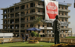 This requires a bit of explanation. The statue is of Rafik Hariri, the former prime minister murdered by a car bomb so enormous that it damaged the building around it, including the hotel building you can see in the background. Someone has draped it with a banner protesting the downtown Beirut redevelopment championed by Hariri, but which also drove up the national debt and was allegedly rife with corruption.